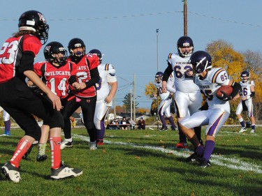 A Gatineau Vikings runner is confronted by a trio of Cornwall Wildcats defenders during play on Sunday October 23, 2022 in Cornwall, Ont. Cornwall won 47-13. Greg Peerenboom/Special to the Cornwall Standard-Freeholder/Postmedia Network
