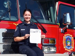 Public educator Jess Jorritsma of the Perth East/West Perth fire department holds one of the escape plan templates families can fill out for a chance to win a family pizza dinner delivered in a fire truck during open houses as part of Fire Prevention Week this week. GALEN SIMMONS