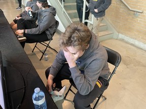 Battalion forward Matvey Petrov reacts to his and two teammates getting throttled in the NHL23 video game.