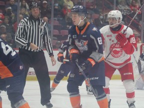 Soo Greyhounds captain Bryce McConnell-Barker and Flint Firebirds centre Ethan Hay in first period OHL action at the GFL Memorial Gardens on Wednesday night. The  locals surrendered two short-handed goals in a 5-3 loss to the Firebirds.