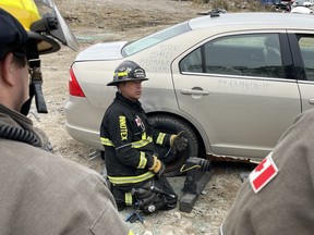 Jason Defosse in North Bay training fire fighters about extraction techniques for electric cars