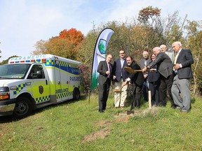 Dignitaries gather for a ceremonial groundbreaking at Frontenac Paramedics' new ambulance base in Kingston on Wednesday.