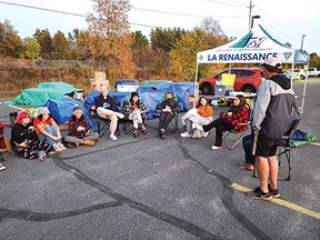 Photo supplied with permission
École Catholique La Renaissance students set up in the Giant Tiger parking lot in support of homelessness. Grant Lewis presented to them about the role of the Helping Hands Food Bank.