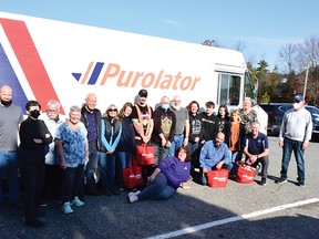 Photo by KEVIN McSHEFFREY
These are just some of the volunteers that assisted with the Purolator Tackle Hunger Red Bag Campaign in Elliot Lake last week.