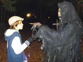 Photo by LESLIE KNIBBS
A Massey area youth confronts one of the monsters on a Haunted Trail event from a previous year.