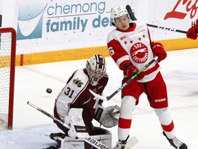 Peterborough Petes goalie Michael Simpson blocks a shot on Soo Greyhounds forward  Landen Hookey during first period OHL action on Thursday at the Memorial Centre in Peterborough. The Hounds dropped a 6-2 decision to the Petes.