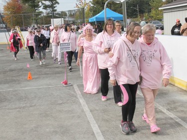 Walkers head out at the start of the 2022 Walk For Her, including event creator Lana Gorr (second row left) and in front 2022 honorary survivor Lorraine MacKenzie and Marilyn Gorr, Lana's mother who battled cancer this year. Anthony Dixon