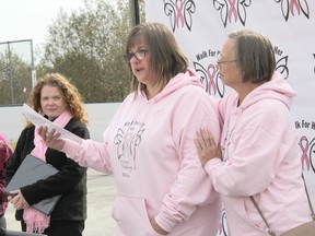 2022 Walk For Her honorary survivor Lorraine MacKenzie, right, supports event creator and organizer Lana Gorr during the poignant opening to the fundraiser held on Oct. 1 at the Shady Nook Rec Centre. Anthony Dixon