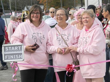 The 2022 Walk For Her gets underway with a ceremonial ribbon cutting by, from left, event creator and organizer Lana Gorr, 2022 honorary survivor Lorraine MacKenzie, and Marilyn Gorr, Lana's mom who battled cancer this year. Anthony Dixon