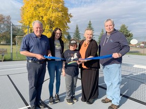 Taking part in the official opening of the new multi-game court surface at the Pleasant View Park tennis court in Laurentian Valley was, from left, Mayor Steve Bennett, volunteers Audrey Oickle and Griffin Richardson, Benita Richardson, Pleasant View Park Committee chairwoman, and Councillor Chris Pleau.