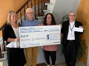 The Renfrew County Real Estate Board recently made a $10,000 to the Pembroke Regional Hospital Foundation and its Cancer Care Campaign. Taking part in the donation was, from left, Kristen Graves Kuiack and Dean Burchart of the Real Estate Board and Leigh Costello and Roger Martin, from the PRHF.