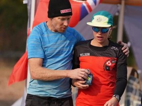 Woodstock's Amanda Nelson gets support from Canadian teammate Mike Huber at this month's Backyard Ultra Team World Championships in B.C.