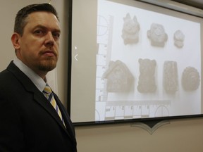 Det.-Sgt. Mike Howell is pictured by a display of cartoon-like moulded pieces of fentanyl recently seized during drug arrests in Sarnia. Police are concerned the drugs could be mistaken for candy, chocolate or edibles, and cause harm to people who ingest them without knowing what they actually are. (Tyler Kula/ The Observer)