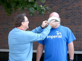 Shawn Zettel, Sarnia site safety manager, is about to get "pied'd' by Shane Ferneyhough, the safety group leader and operations integrity co-ordinator, to raise money and awareness for the United Way of Sarnia-Lambton. The Imperial Sarnia Site will wind down its employee campaign the end of October. United Way photo