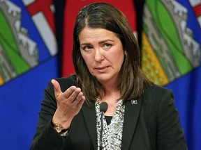 Danielle Smith speaks to media after being sworn in as Alberta's new premier in Edmonton on October 11, 2022.