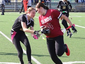 Kaydan Francoeur, right, of St. Charles Cardinals, attempts to evade Hailey Larochelle, of the Lively Hawks, during flag football action at James Jerome Sports Complex in Sudbury, Ont. on Monday October 3, 2022. John Lappa/Sudbury Star/Postmedia Network