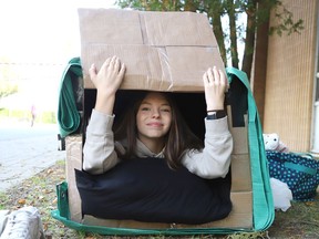 Olivia Depatie, 14, participates in the Homeless for a Night activity at Ecole secondaire catholique Champlain in Chelmsford, Ont. on Wednesday October 5, 2022. About 100 students spent the night in cardboard boxes and tarps for shelters to experience the reality of being homeless. John Lappa/Sudbury Star/Postmedia Network
