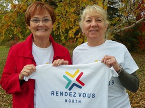 Rendezvous North co-chairs Judi Straughan (left) and Linda Cartier (right) unveil conference T-shirts as the Sudbury Arts Council and Rendezvous North committee prepare to host a Northern Ontario arts conference this weekend at the McEwen School of Architecture. Supplied