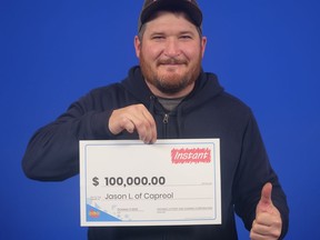 Jason Lamoureux of Capreol is $100,000 richer after winning the top prize with Instant 5X The Cash. OLG photo