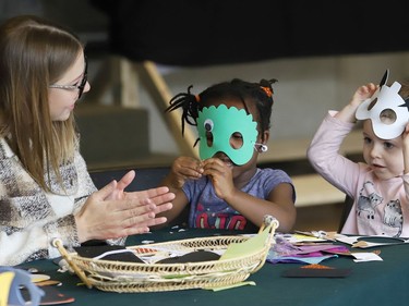 Early childhood educator Amanda Wilson and Janama Kingsley-Emereuwa, middle, and Avah Lovegrove, of the Larch Street Kids Child Care Centre, create masks at a celebration marking Child Care Worker and Early Childhood Educator Appreciation Day at Tom Davies Square in Sudbury, Ont. on Tuesday October 18, 2022. A release issued by the City of Greater Sudbury said, "The day recognizes the commitment, hard work and dedication of Early Childhood Educators (ECEs) and people who work with young children." John Lappa/Sudbury Star/Postmedia Network