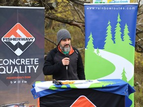 Dan Barrette, executive director of the Rainbow Routes Association, gives an update during the 10-year celebration and official opening of the Fisher Wavy Trail on Thursday.