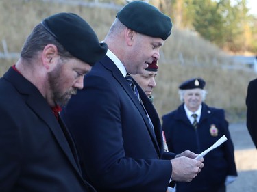 Daryl Adams, middle, a veteran and retired Staff Sergeant of the Greater Sudbury Police Service, leads a ceremony at a flag-raising event to mark the annual Royal Canadian Legion Poppy Campaign in Sudbury, Ont. on Friday October 28, 2022. A massive poppy flag was raised at the ceremony. John Lappa/Sudbury Star/Postmedia Network