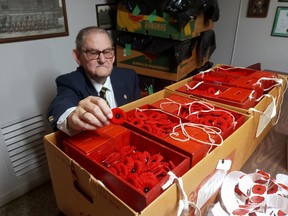 Adrian Williams, poppy campaign chair for Royal Canadian Legion Lord Elgin Branch 41, St. Thomas, gets ready for start of this year's fundraiser on Friday. Eric Bunnell