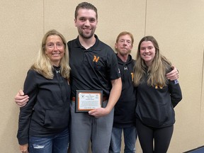 From left to right, Susan Barfoot, Ethan Woods, Jeff Barfoot and Rachel Barfoot are photographed at the Owen Sound Minor Lacrosse annual awards night Tuesday. Woods and Rob Campbell received the first Andrew Barfoot OSML Memorial Coaches Award. Photo supplied.