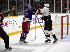 Colby Barlow and Simon Motew square up behind the net after the whistle as the Owen Sound Attack host the Kitchener Rangers inside the Harry Lumley Bayshore Community Centre on Saturday, Oct. 1, 2022. Greg Cowan/The Sun Times
