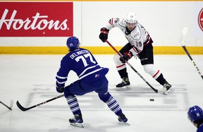 Colby Barlow attempts to drive a pass through the slot as Ethan Del Masto looks to intercept as the Owen Sound offense hosts the Mississauga Steelheads inside the Harry Lumley Bayshore Community Center on Saturday October 8, 2022. Greg Cowan / The Sun Times