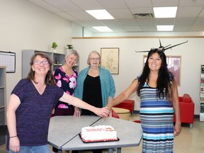 NorQuest College’s (l-r) Team Lead Odette Lloyd, Academic Program Manager Jadine Sherman, ESL Tutor Fran Rusnell and Program Support Fay Myshyniuk cut the cake at the celebration of their new Whitecourt location.