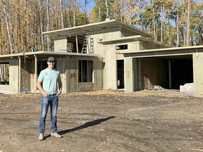 Kelly Rogers from Ecoplast Solutions with a home outside of Millet being built with millions of water bottles.
Christina Max