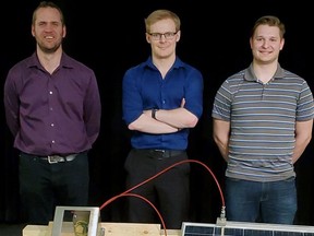 Kyle Victor, Carson West and Nathan Crombie with the prototype of a system to clean solar panels.