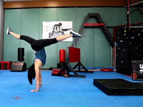 Alma Chan does a handstand at Totalfit Ninja Warrior on Thursday, April 22, 2021. Laura Beamish/Fort McMurray Today/Postmedia Network
