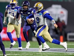 Zach Collaros (8) of the Winnipeg Blue Bombers runs with the ball in the first half of the 109th Grey Cup game between the Toronto Argonauts and Winnipeg Blue Bombers at Mosaic Stadium on Nov. 20, 2022 in Regina.
