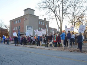 Members of local unions rally outside the office of Bruce-Grey-Owen Sound MPP Rick Byers on Tuesday, November 1, 2022. The protest was held in opposition to the Ontario Conservative government’s Keeping Students in Class Act.