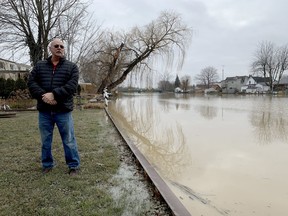 Rob Simpson stands by his Sydenham River seawall on Jan. 13, 2020. The seawall couldn't hold water back from flooding the crawlspace of Simpson's Wallaceburg home after a weekend of rainfall. Jake Romphf