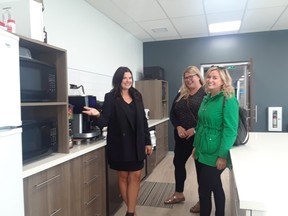 Marla Howard (left), MNP LLP’s Regional Marketing Manager, was proud to display to guests attending the grand opening of MNP’s new office to Allyson Pele from Northwest Business Centre and Megan Dokuchie representing the City of Kenora, all seen together here in the appealing kitchen and dining area staff have nicknamed ‘The Bistro’. Photo by Ruth Bowiec