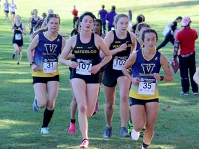 Laurentian University cross-country runners Angela Mozzon (35) and Sarah Booth (31) compete at OUA championships in London, Ontario on Saturday, October 29, 2022.