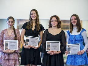 From left, Piper Orrick, Leah Hagan, Jessica MacDonald and Sarah Weaver each hold their Jonathan and Dawn Mau Awards of Encouragement they received during the Quinte Ballet School of Canada awards ceremony on Friday in Belleville, Ontario. ALEX FILIPE