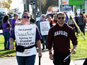 People marched along Keil Drive in Chatham to support the education workers who striked after the provincial government invoked the notwithstanding clause to force a contract on them Nov. 4, 2022. (Tom Morrison/Postmedia Network)