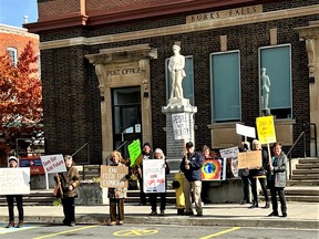Members of Climate Action Almaguin continue to protest outside post office buildings in Almaguin. The latest protest, outside the Burk's Falls Post Office, took place ahead of a presentation on electric vehicles the group will host later this month in Burk's Falls.