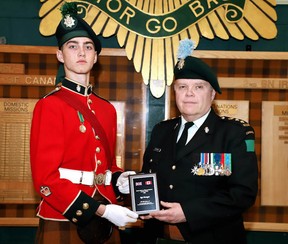 Sgt. Amon Ranger is presented with an award from Kevin McCormick, honorary colonel with the Irish Regiment of Canada.