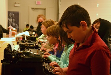 Brock Hellens, a grade 5 student from Milverton Public School, learns how to use a typewriter with his classmates at the Stratford-Perth Museum Tuesday. Galen Simmons/The Beacon Herald/Postmedia Network
