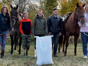 These Horses for Hope participants want to send a thank-you to  Country Junction Feeds for their ongoing support of the program.