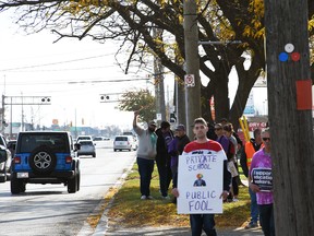 Supporters of Canadian Union of Public Employees' school support worker strike could be seen along Keil Drive in Chatham from Richmond Street to the Thames River Nov. 4, 2022. (Tom Morrison/Chatham This Week)