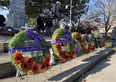 Poppies pinned to wreaths at the foot of the cenotaph in Wallaceburg at the conclusion of the Remembrance Day program on Thursday, Nov. 11, 2021 in Wallaceburg, Ont. Peter Epp/Postmedia