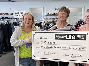 Geri Ann Hughson, founder of charity FreeHelpCK, left, accepts a $3,130 cheque from New Life Thirft Store volunteers Jean Noordam and Marlene Smith. (Handout/Postmedia Network)