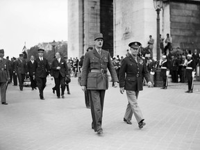 A file picture taken in June 1945 in Paris shows French General Charles de Gaulle (L) and US General Dwight David Eisenhower (R) walking near the Arc de Triomphe (Arch of Triumph).  As Supreme Commander of Allied Forces in Europe, the future president, "Ike" Eisenhower led the planning for what was codenamed Operation Overlord, gave the order to attack and oversaw its successful completion. De Gaulle was largely sidelined from preparations for the Normandy landings and the snub irked him for years.  The ceremonies to celebrate the 70th anniversary of the landing in June 2014 are to be attended by an A-list of international leaders. AFP PHOTOSTR/AFP/Getty Images