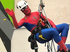 Urban Forestry-Arboriculture Coordinator, Kristopher Von Sompel, has some pre-Halloween fun with prospective high school students as he dangles from a rope dressed as Spiderman, while answering their questions about being an arborist.